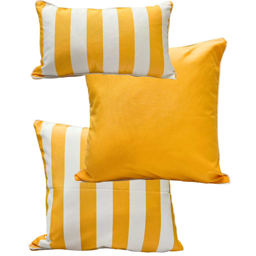 A set of three yellow and white striped outdoor cushions with one solid yellow cushion, two with stripes on a white background.