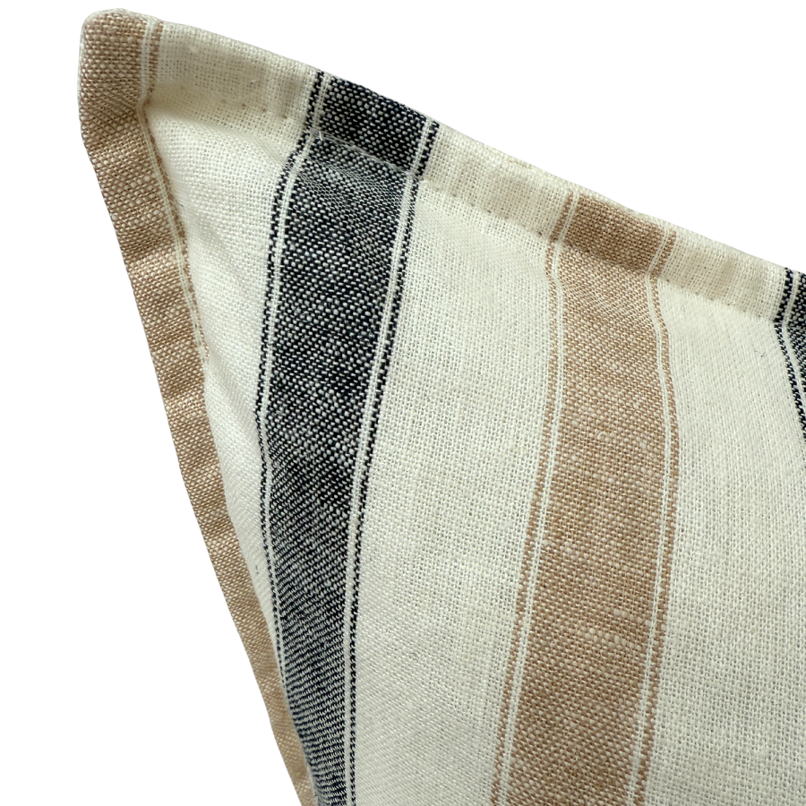 Close-up of a striped fabric cushion with brown, black, and beige colors.