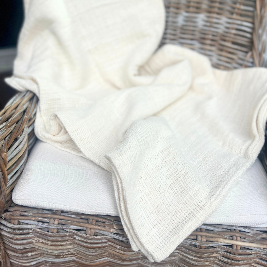White blanket on a chair.