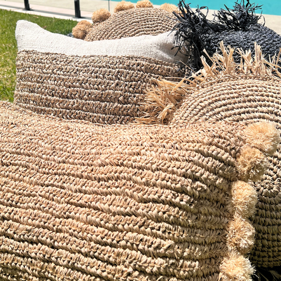 Cushions stacked together on a pool.
