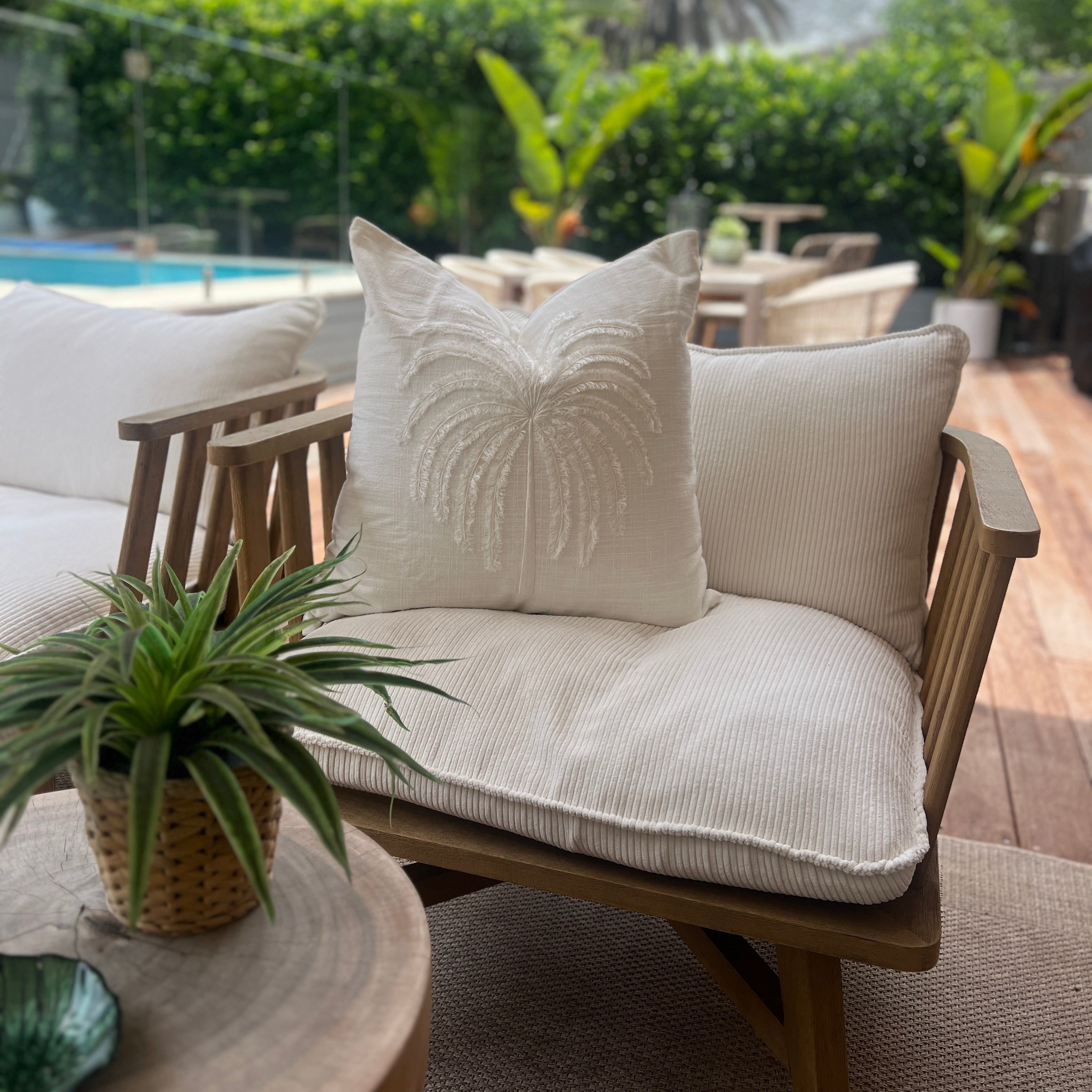 White cushion on a chair.