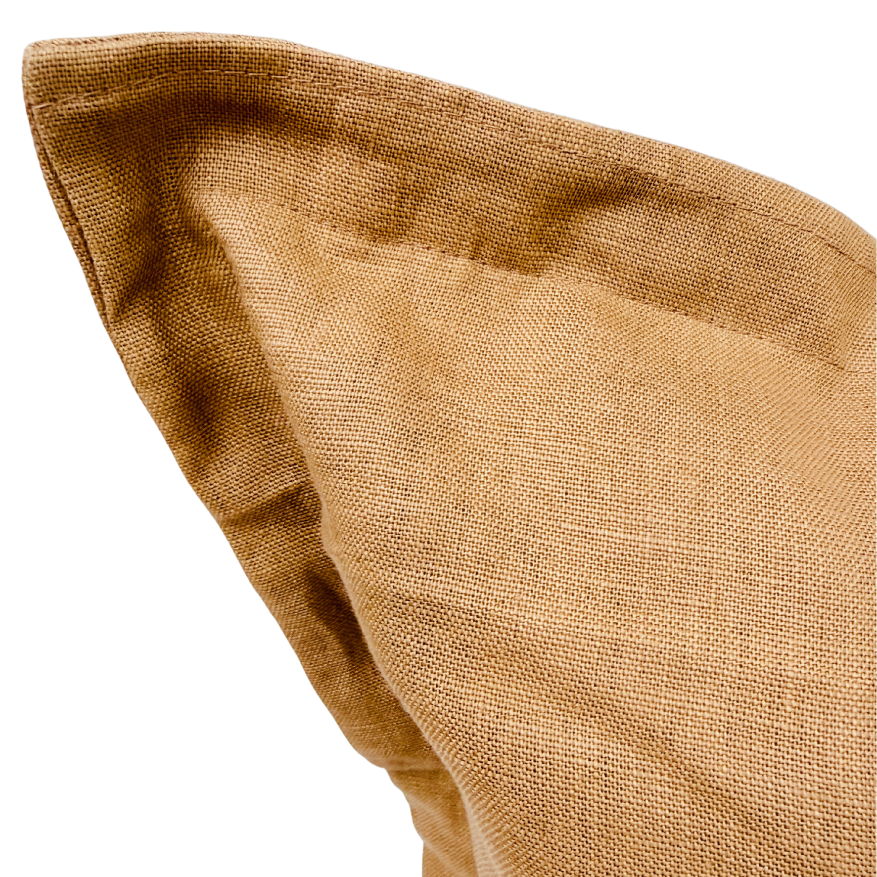 Close-up of a brown fabric cushion.
