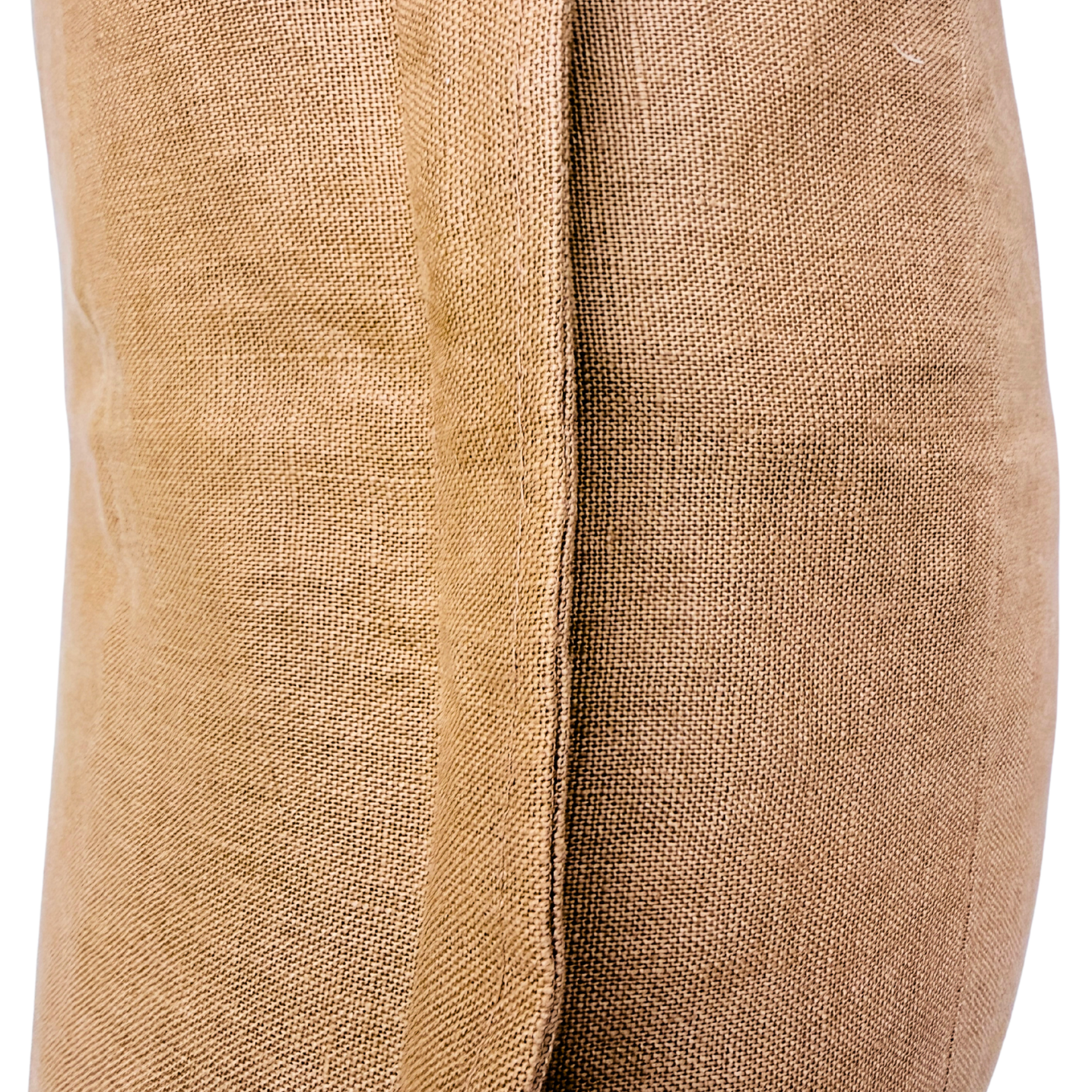 Close-up of beige fabric with a visible seam.