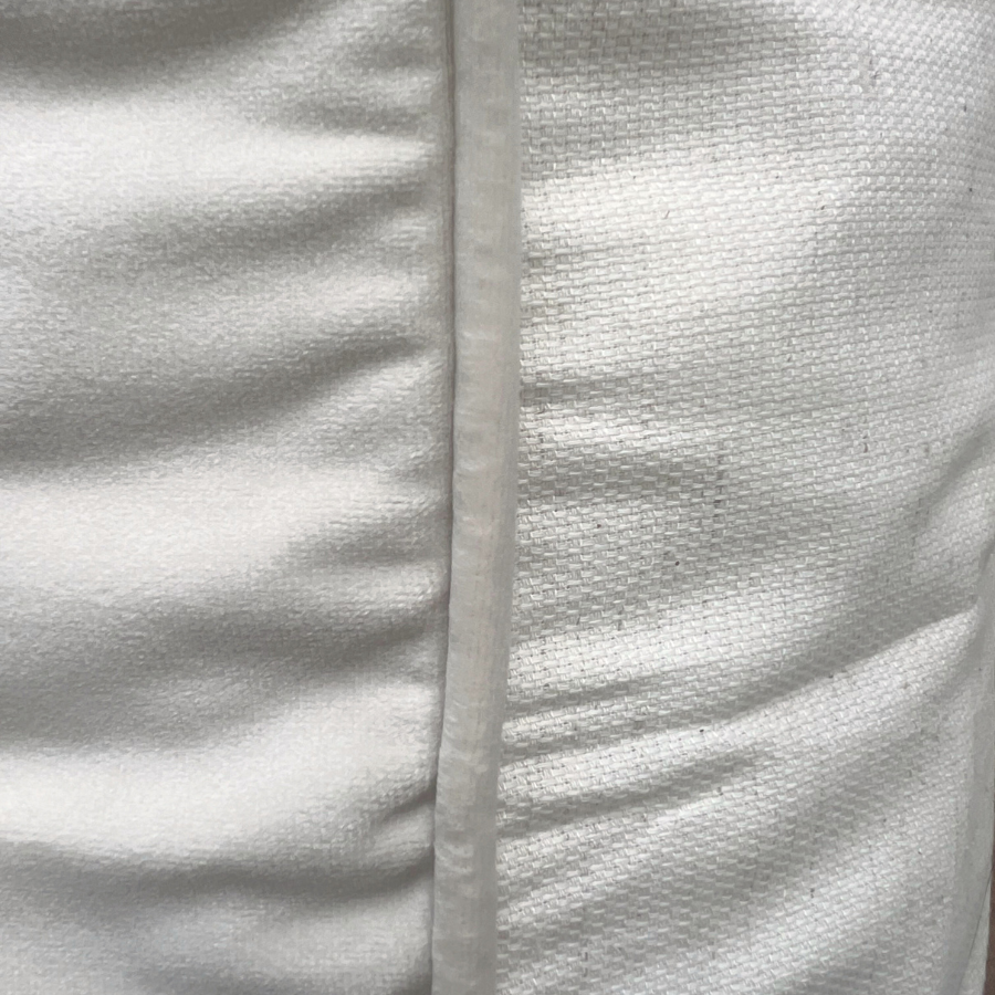 Textured white fabric.