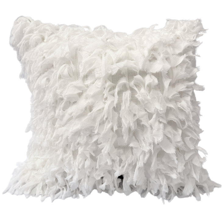 White fluffy cushion.