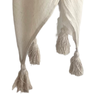 White blanket with decorative art.