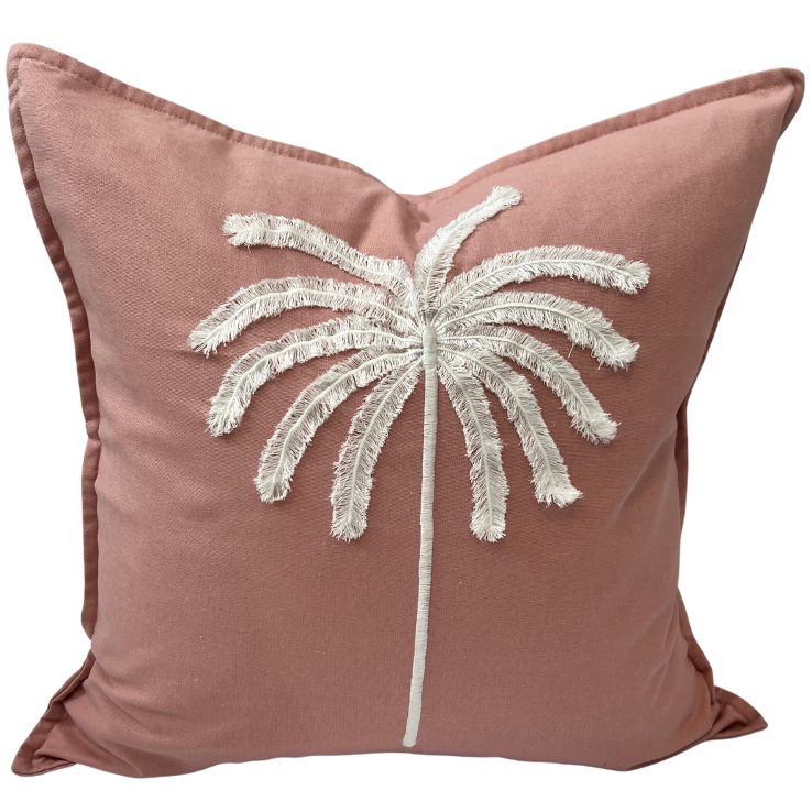 A cushion cover with a tufted embroidered palm design in black on an ivory background.
