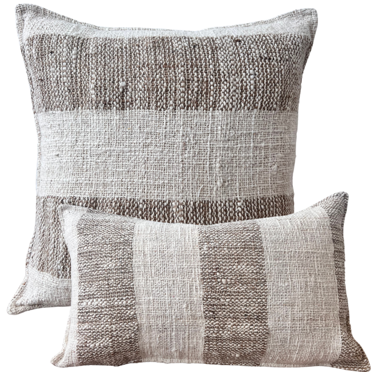 Two square-shaped throw cushions with a striped pattern in sand beige and ivory colors, one larger and one smaller.