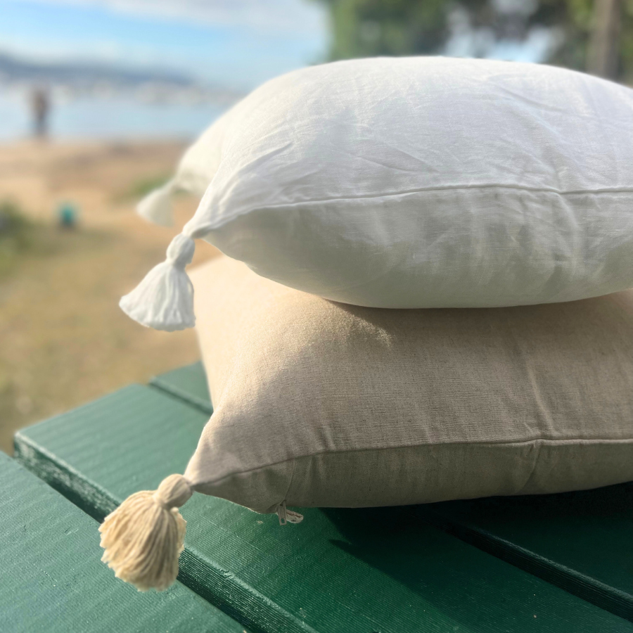 Stack white cushions outdoor.