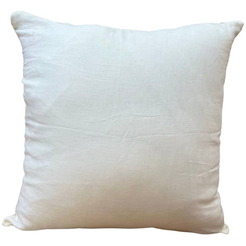 A square-shaped, solid white fine-linen scatter cushion with a visible zipper.